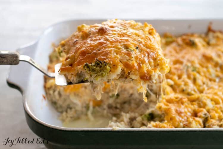 serving spoon lifting up some of the keto chicken and rice casserole recipe