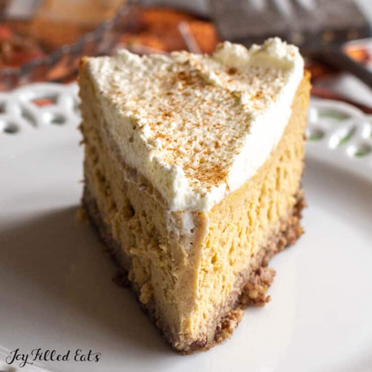low carb keto pumpkin cheesecake recipe shown as a slice on a plate