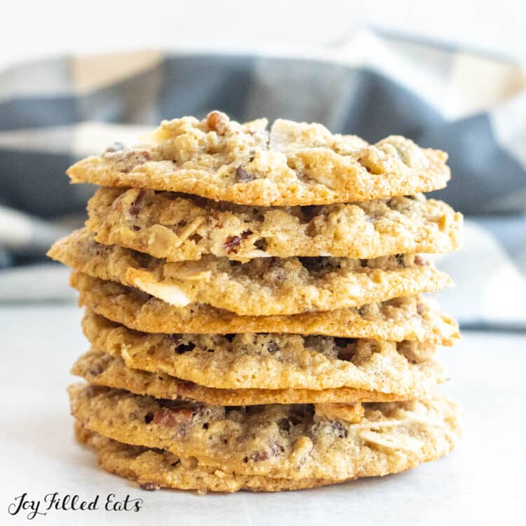 keto cowboy cookies in a stack in front of plaid napkin