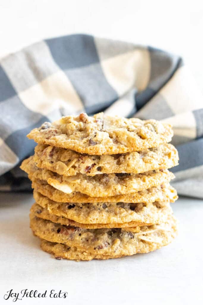 stack of keto cowboy cookies in front of plaid napkin