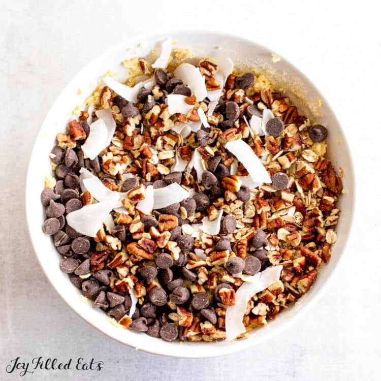 chocolate chips, coconut, and pecans on top of batter