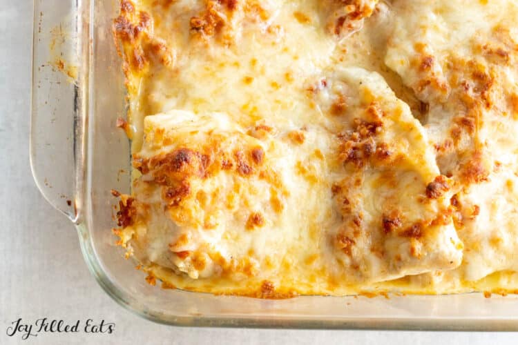baking dish with melted cheese on top of chicken