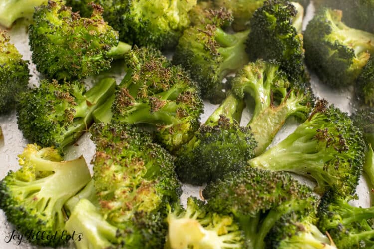 broiled broccoli on foil lined pan close up