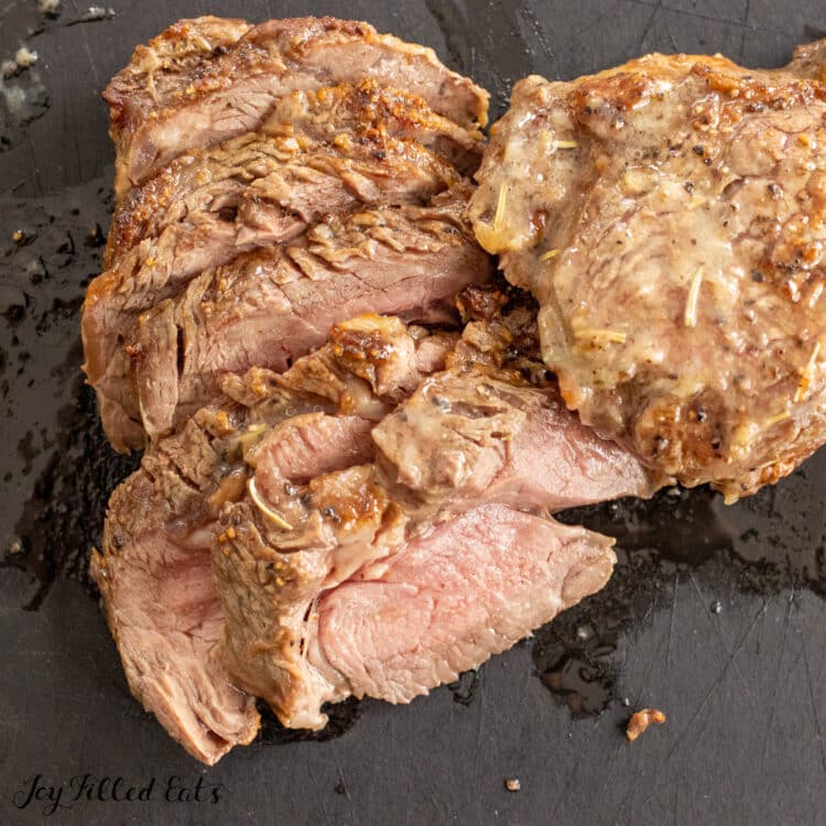 broiled ribeye steak recipe sliced on cutting board