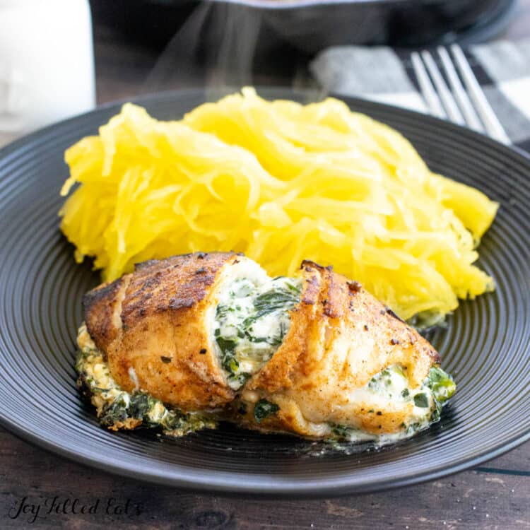 stuffed flounder with spinach served on plate with spaghetti squash