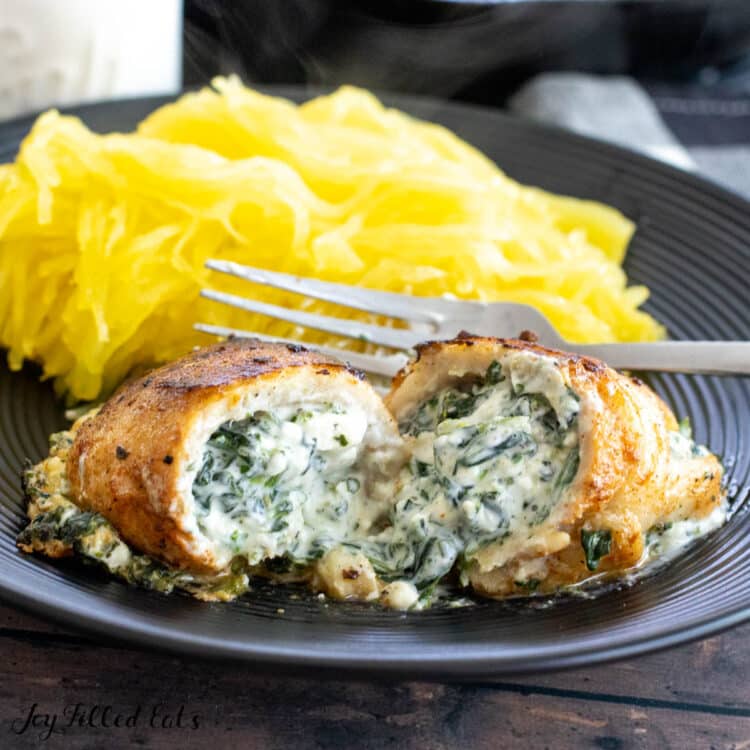 stuffed flounder recipe with spinach florentine filling served on plate with spaghetti squash