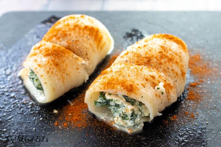flounder fillets with spinach filling on cutting board