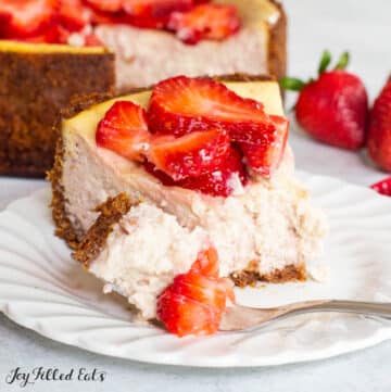 keto strawberry cheesecake recipe served with a slice on a plate with a bite on a fork