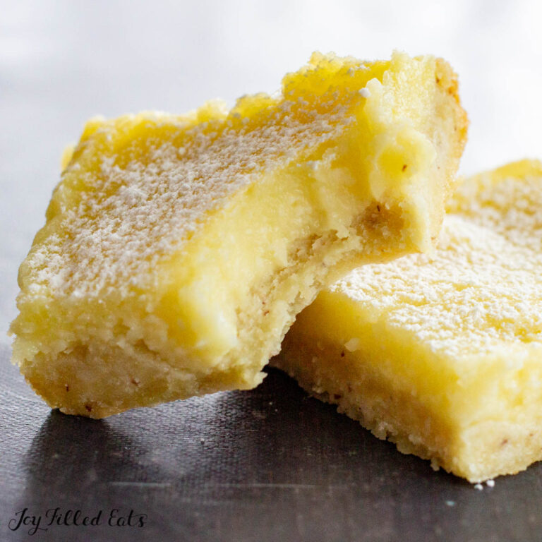 one of the keto sugar free lemon bars with a bite out of it