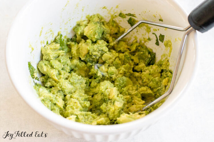 mashed avocados in bowl