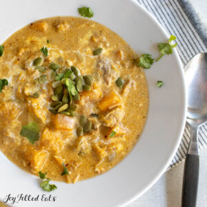 autumn chili recipe with chicken and butternut squash in a soup bowl from overhead