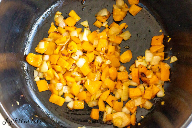 cooked onions and peppers in pot