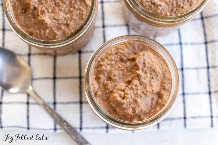 protein pudding recipe shown in three jars from overhead