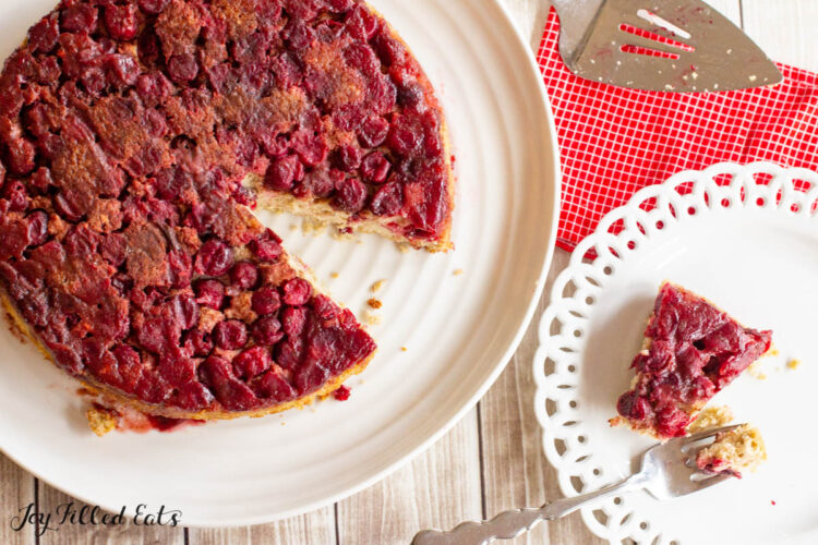 keto cranberry cake recipe from overhead with slice on plate