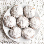 keto snowball cookies close up on a plate from overhead