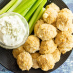 buffalo chicken meatballs recipe on plate with celery and blue cheese dip from overhead