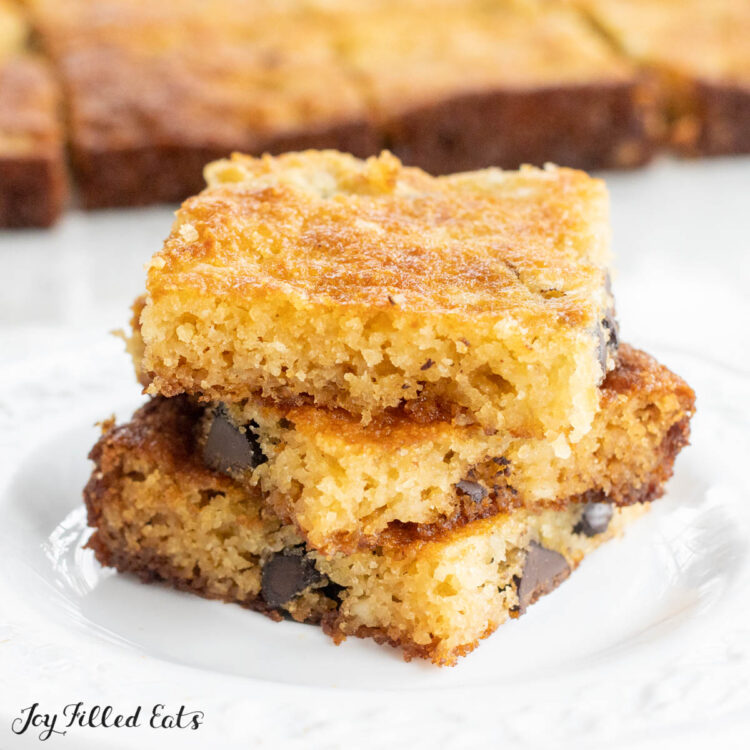 almond flour cookie bars in a stack on a small white plate close up