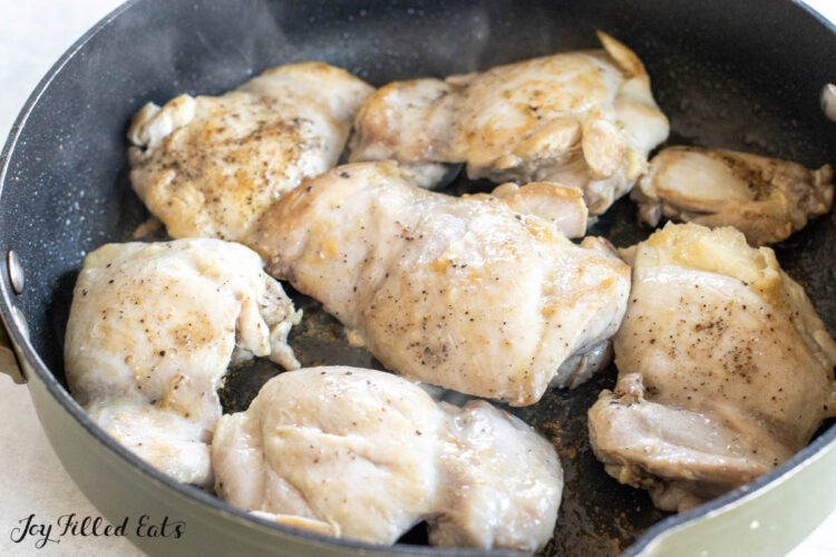 chicken cooking in skillet