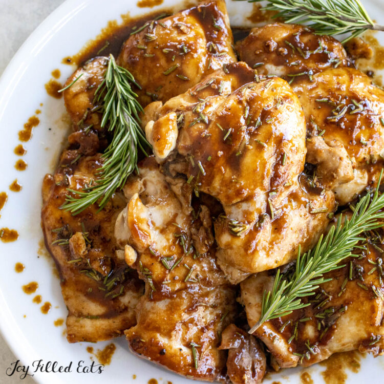 balsamic rosemary chicken thighs recipe on large white serving platter