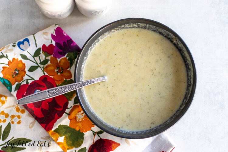 cauliflower leek soup recipe in bowl set on floral napkin