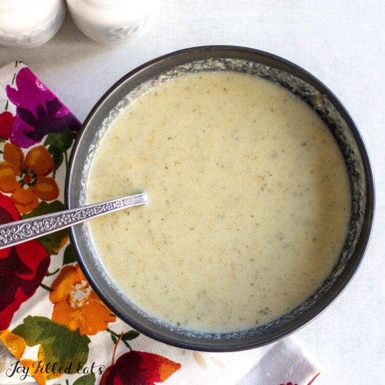 cauliflower leek soup in bowl with spoon