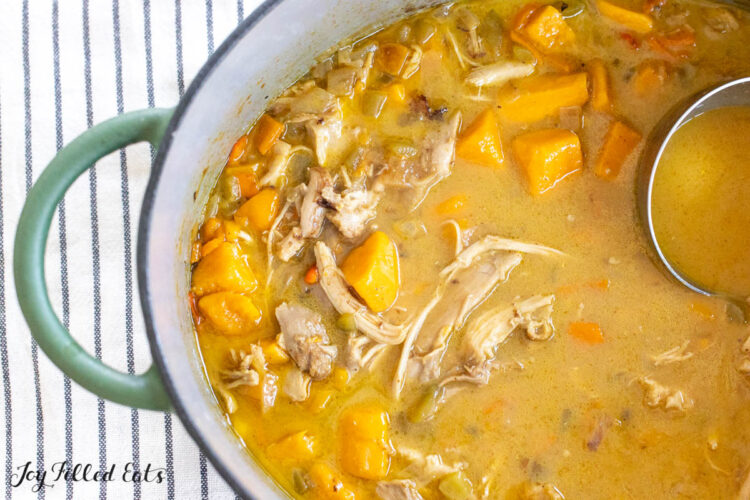 dairy free creamy chicken soup in large soup pot from overhead