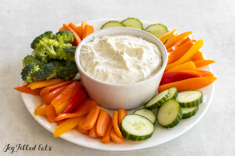 dill dip in bowl in the middle of a veggie platter