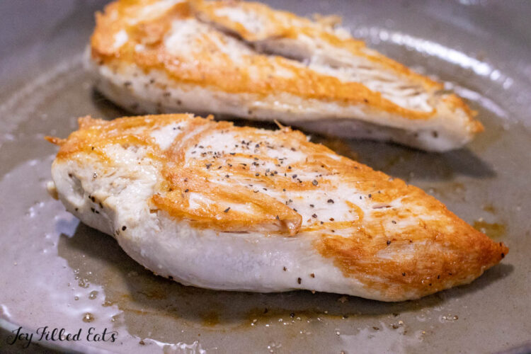 seared chicken breasts in pan