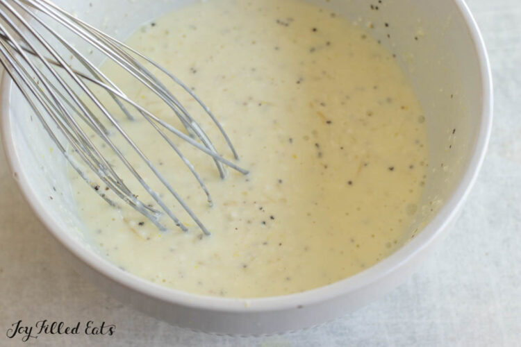 sauce in bowl with whisk