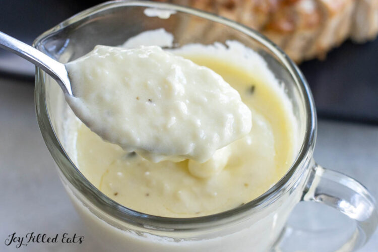 spoon lifting up sauce