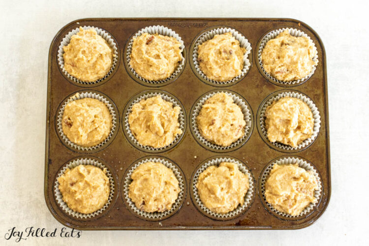 batter in paper lined cupcake tin