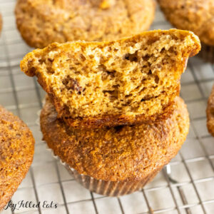 banana bread muffins with almond flour halved and stacked on wire pack