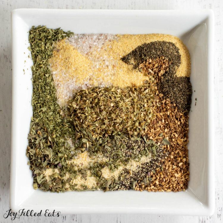 greek seasoning blend on white square plate swirled