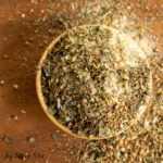 greek seasoning in tiny wooden bowl
