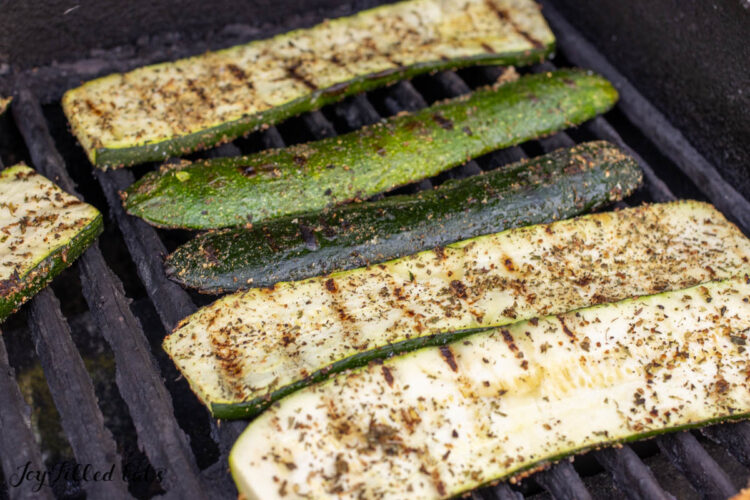 par-cooked zucchini on grill