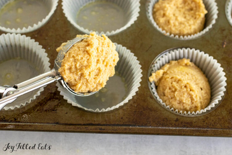cookie scoop adding batter to pan