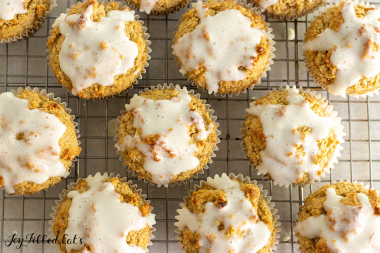 keto cinnamon muffins topped with glaze on wire rack
