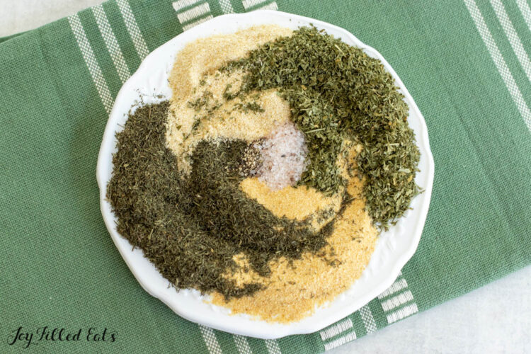 ranch dip mix ingredients swirled together on white plate