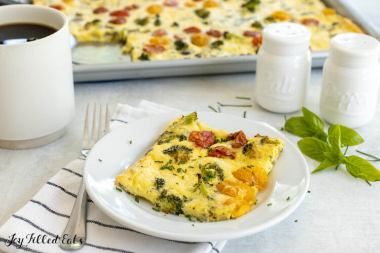 piece of the sheet pan omelet on a white plate