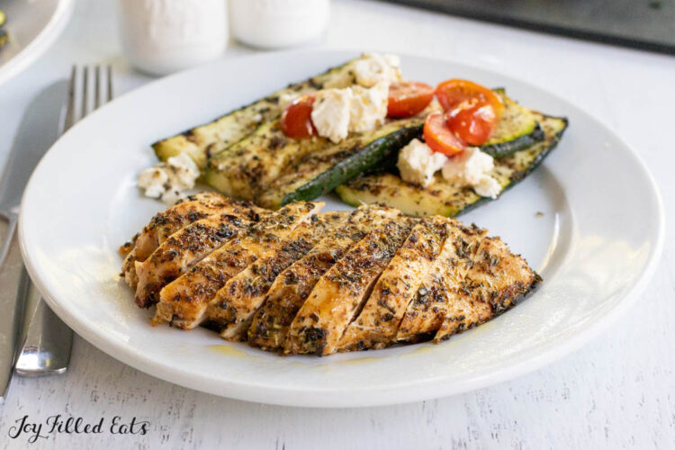 sliced tuscan chicken on dinner plate