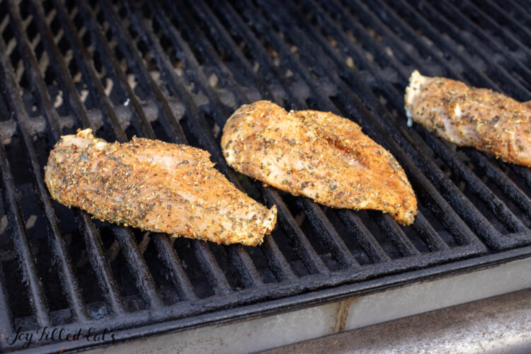 raw chicken on grill