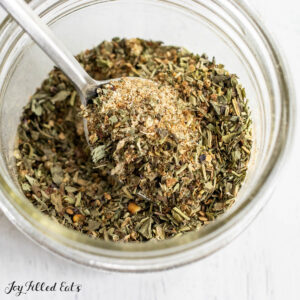 tuscan seasoning recipe in glass jar with spoon