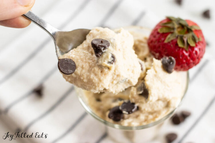 bite of cottage cheese cookie dough on a spoon with dish behind