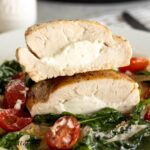 goat cheese stuffed chicken breast cut in half and stacked to show filling