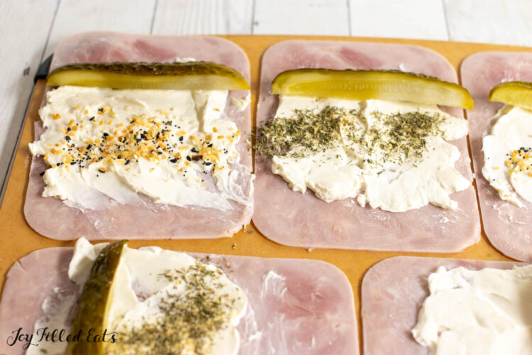 seasonings and pickles added on top of the cream cheese