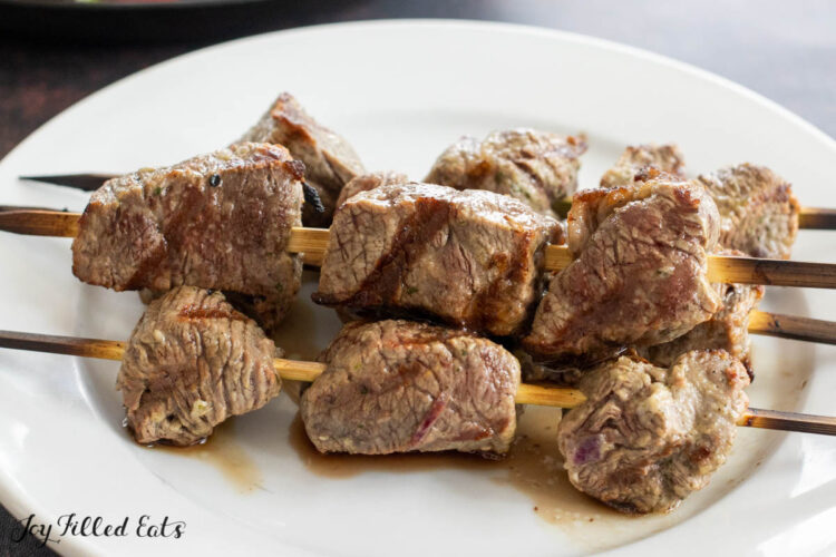 grilled steak cubes on skewers