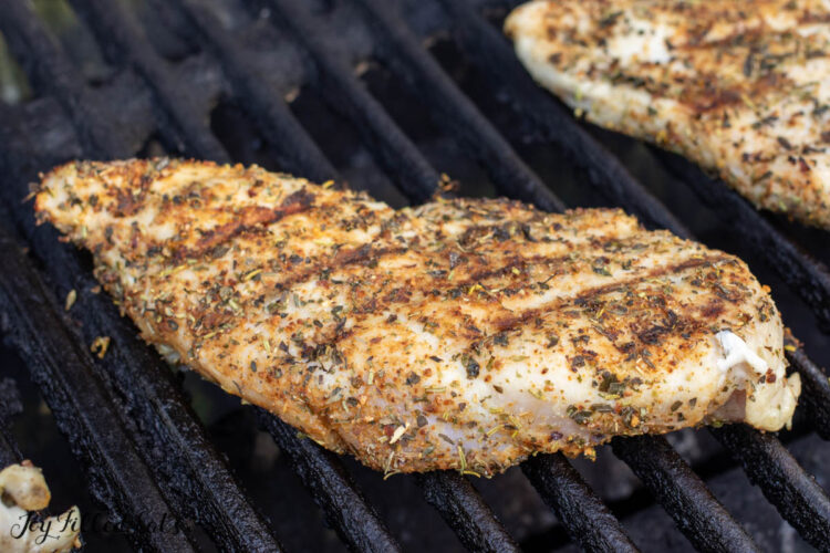 seasoning on chicken on grill