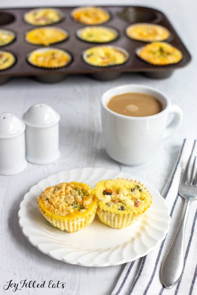 cottage cheese egg bites on small plate with muffin tin behind