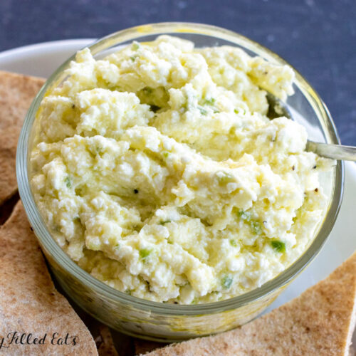 spicy feta dip close up on bowl with spoon