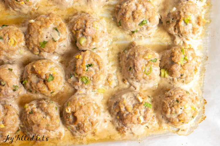 baked meatballs on parchment lined pan